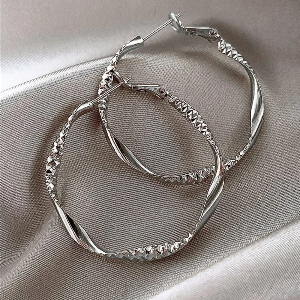 Silver twist design hoop earrings